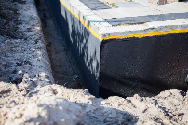 Professional Waterproofing technician working in Adrian, MI